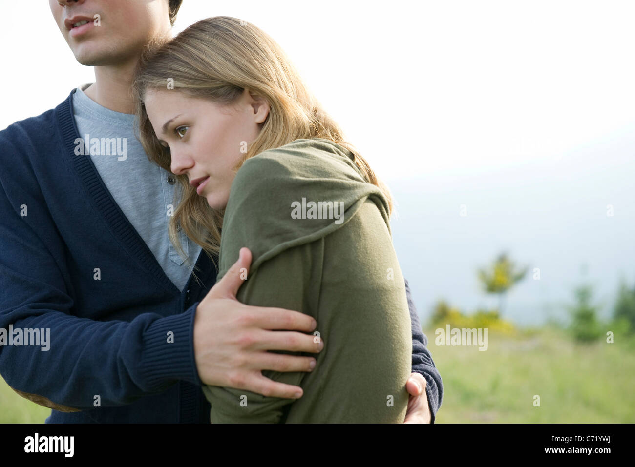 Young woman resting head on boyfriend's shoulder Stock Photo Alamy