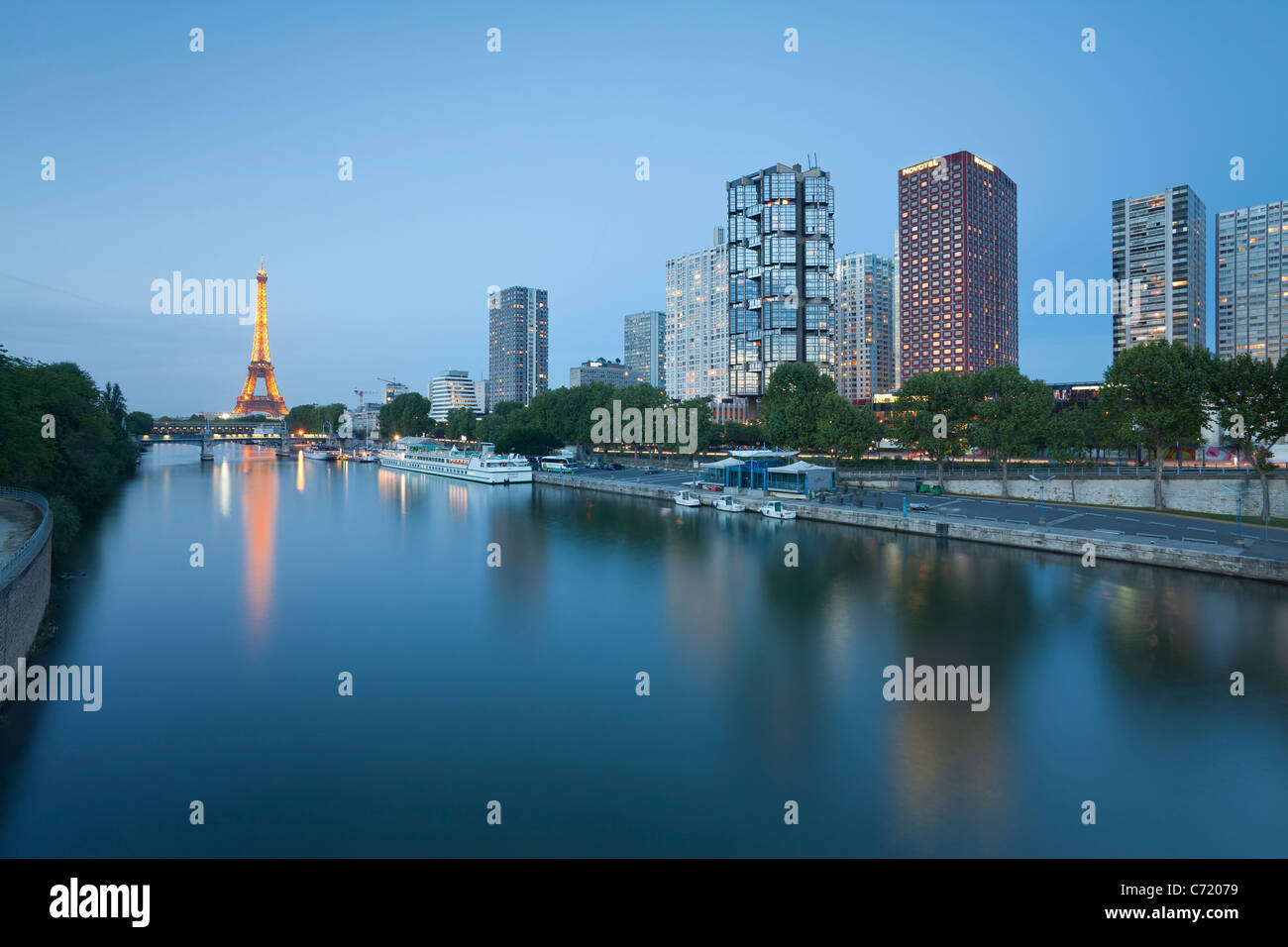 France, Paris, Night View Of River Seine With High-rise Buildings On The Left Bank And Eiffel Tower Stock Photo