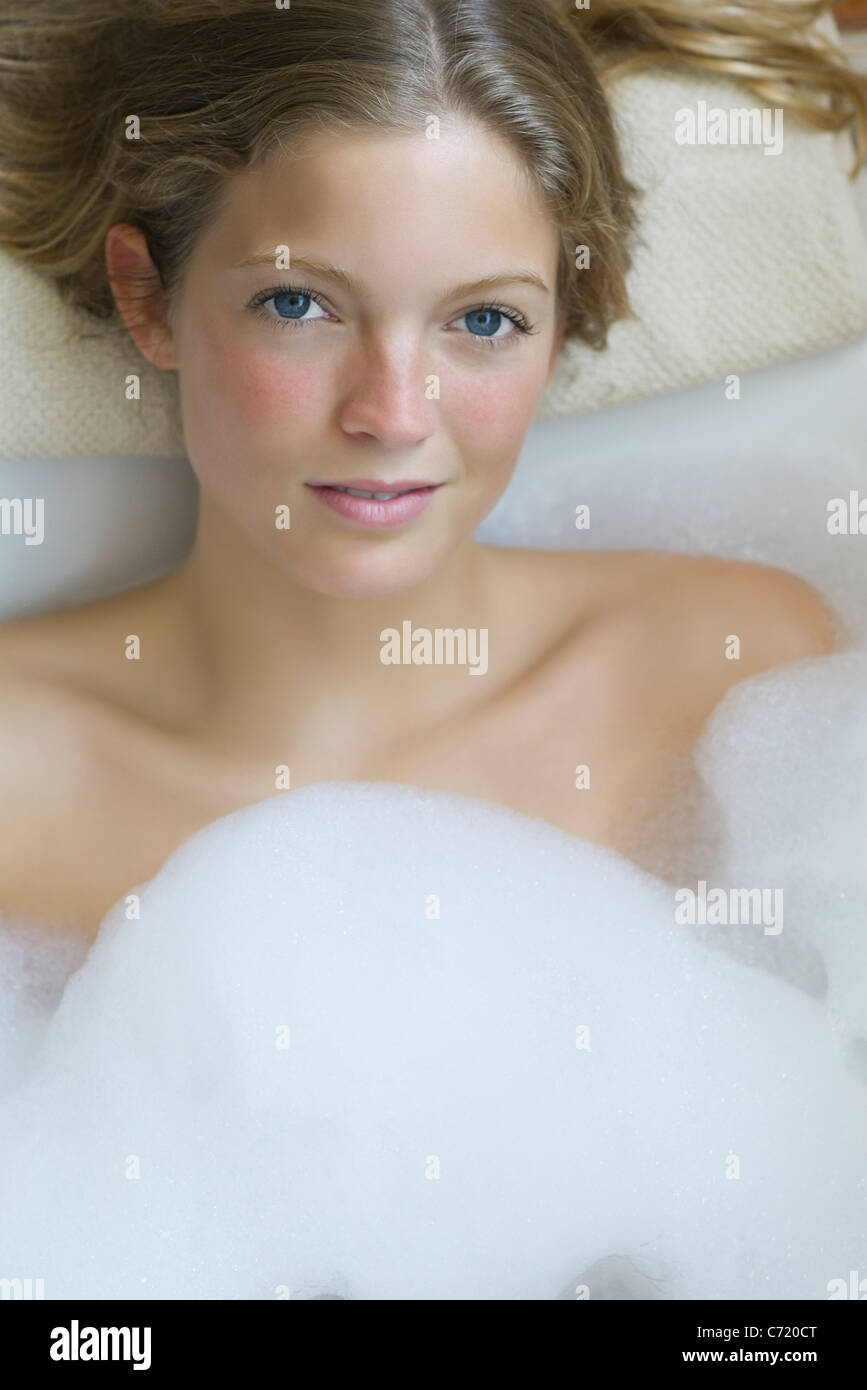 Young woman relaxing in bubble bath, portrait Stock Photo Alamy