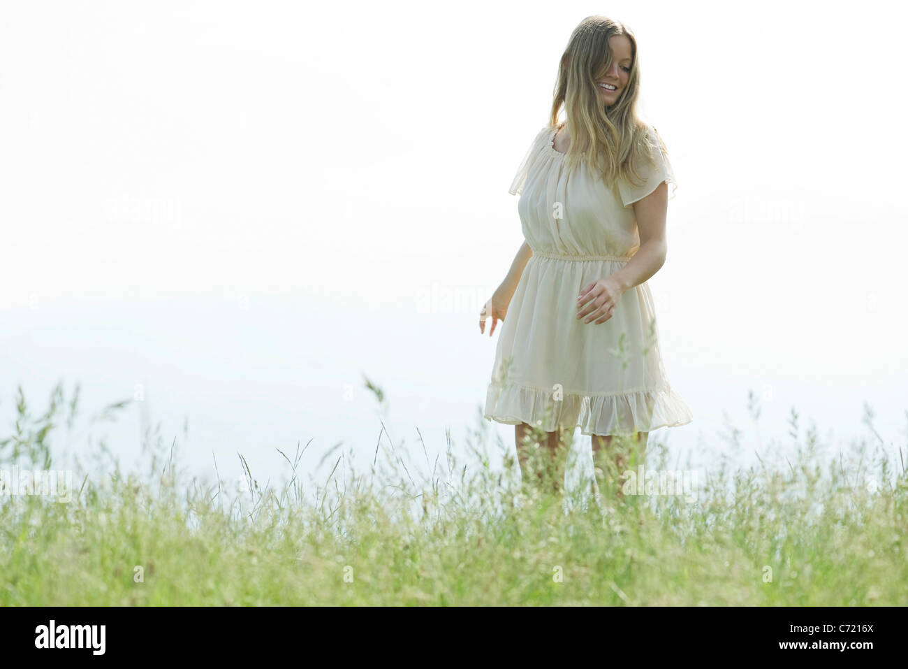 Woman grass field hi-res stock photography and images - Alamy