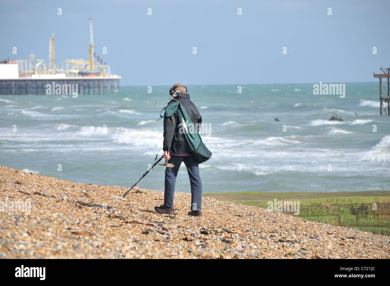 A man metal detecting on the Brighton beach Stock Photo Alamy