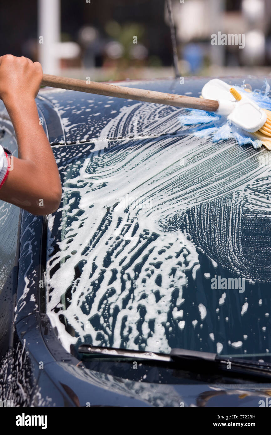 Car washing with sprayed water and Scrub Brush Stock Photo Alamy
