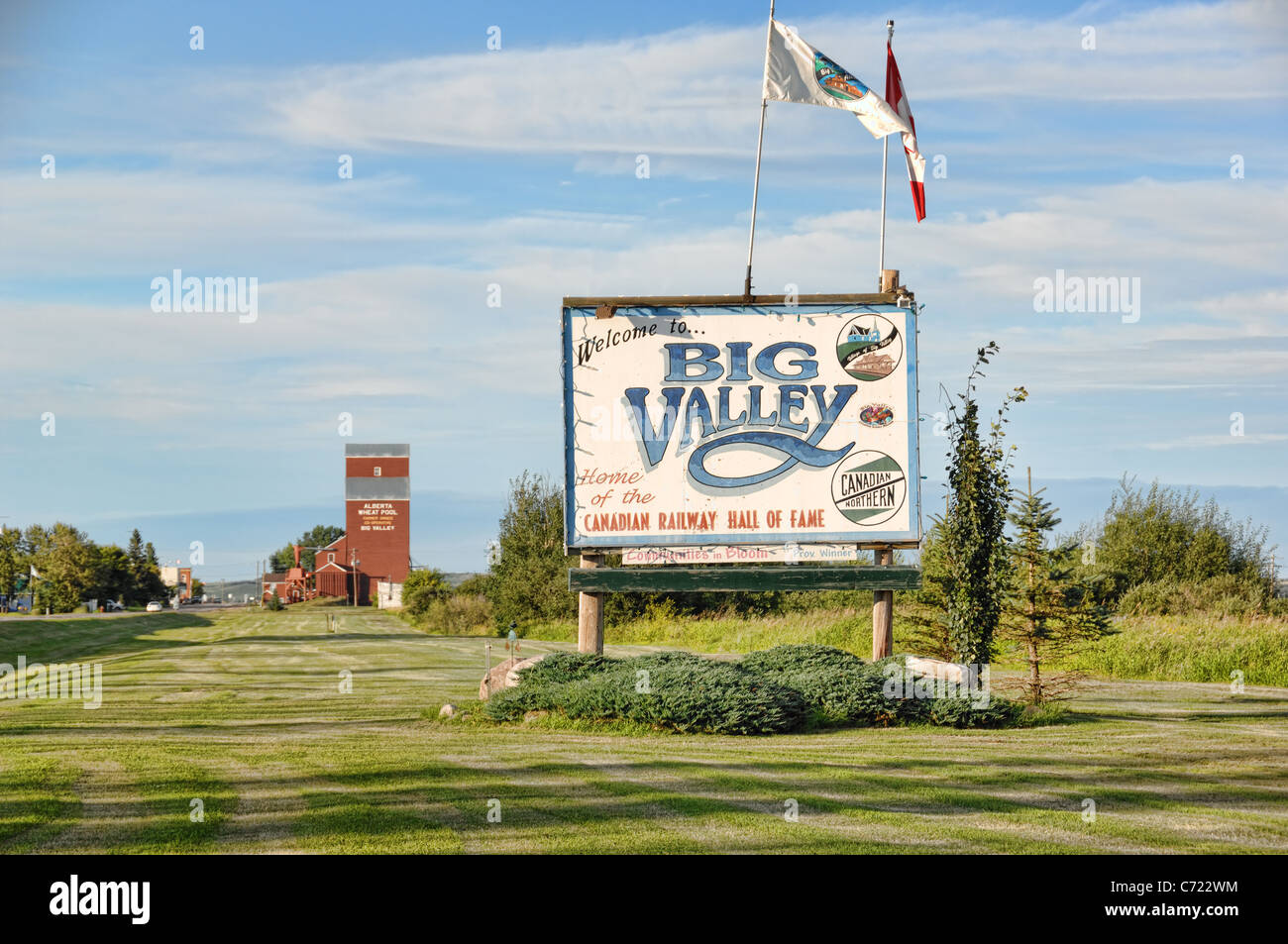 A welcome sign and grain elevator at the entrance to Big Valley, Alberta, Canada. Stock Photo