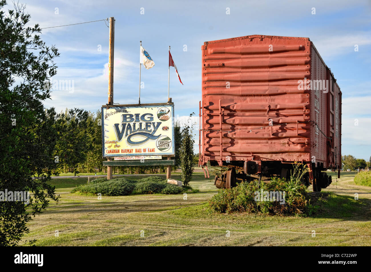 A welcome sign and train boxcar at the entrance to Big Valley, Alberta, Canada. Stock Photo