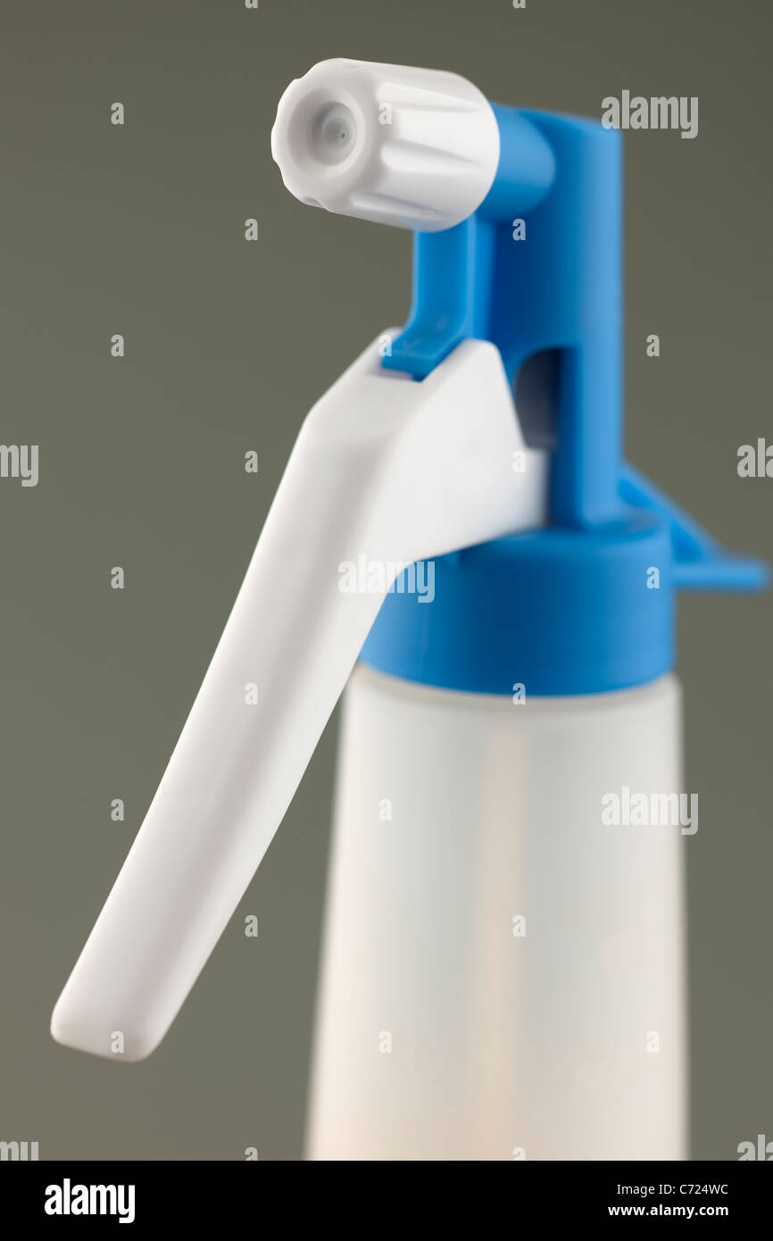 Close up of a nozzle and handle on a spray container Stock Photo