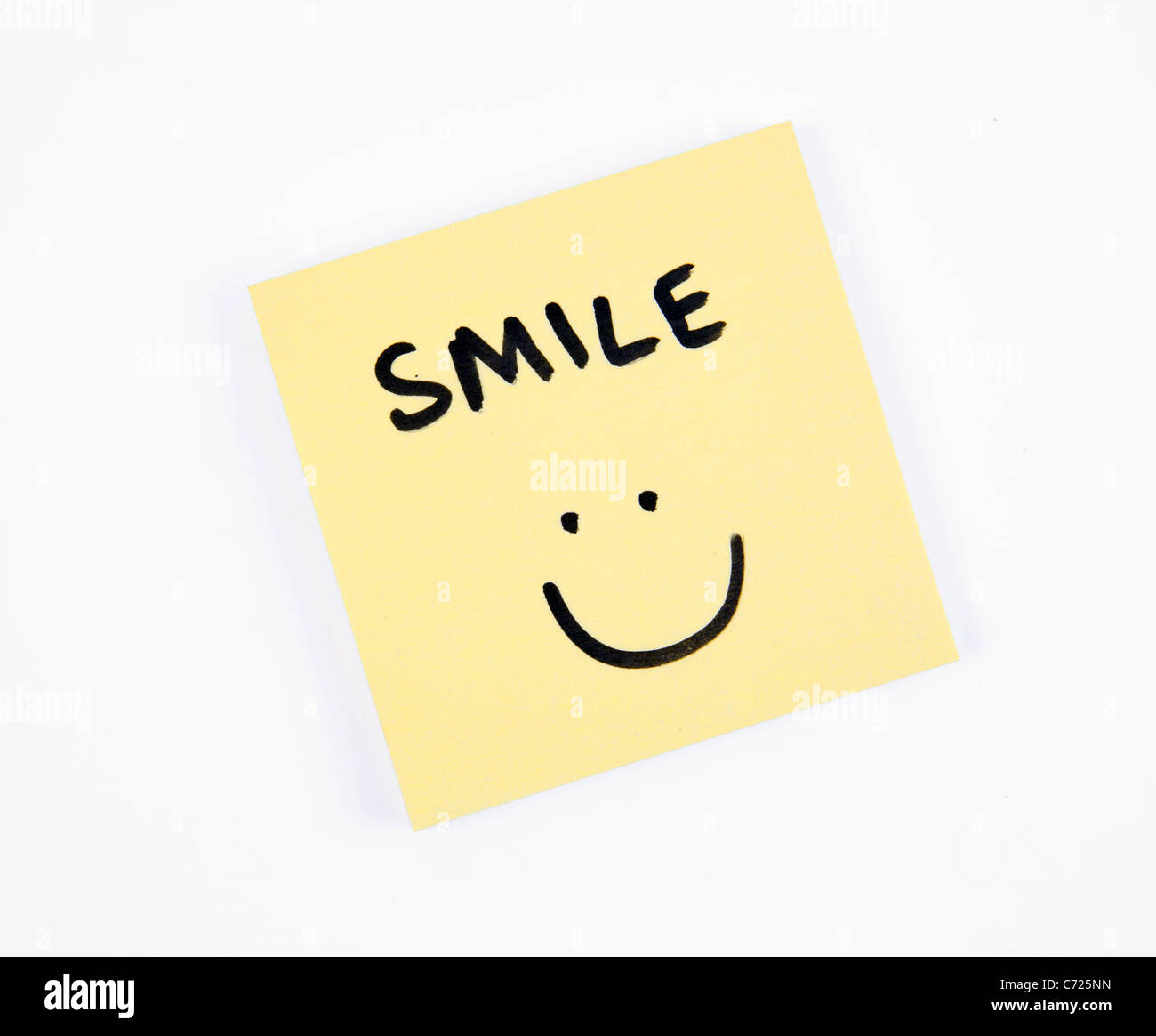 Post-It Note with the Word 'Smile' and a Smiley Face Stock Photo