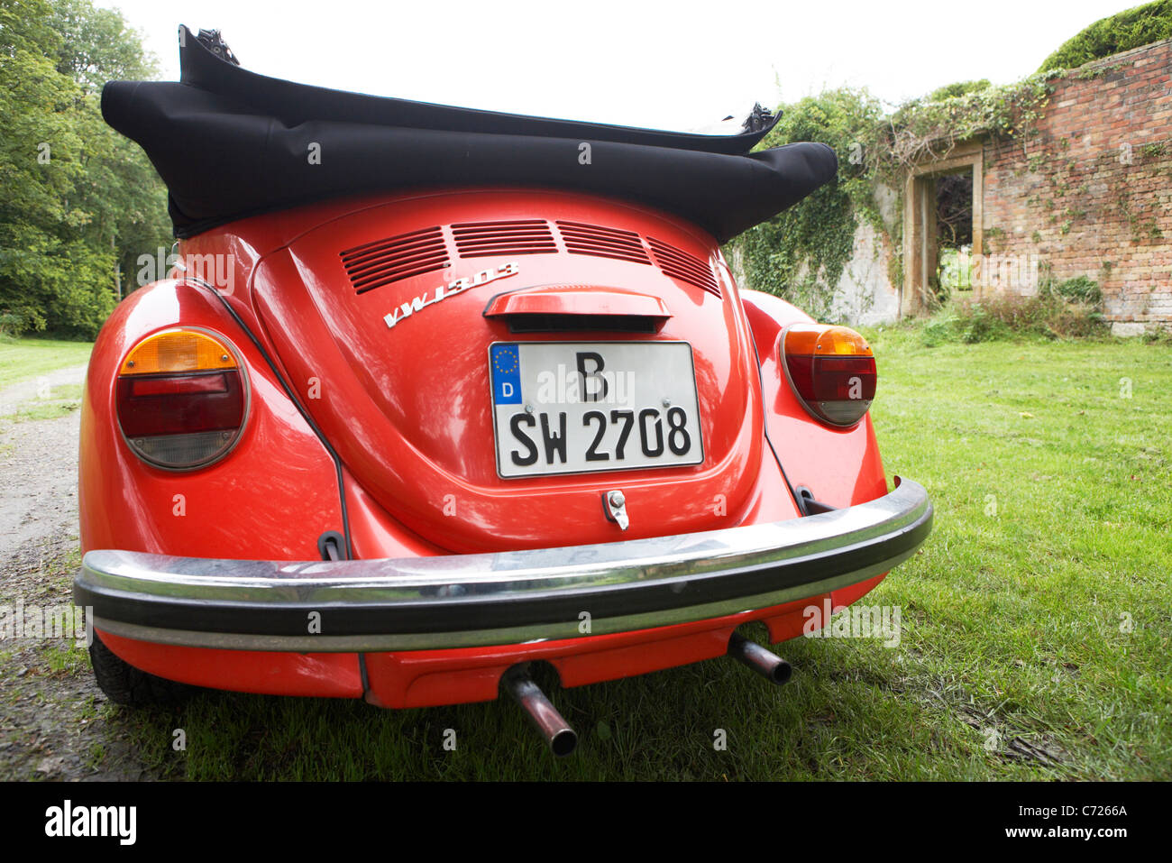 Celebrity chef Sarah Wieners classic red VW Beetle parked at a Victorian walled garden in Dorset. Filming in 2011 for 2012 Germa Stock Photo