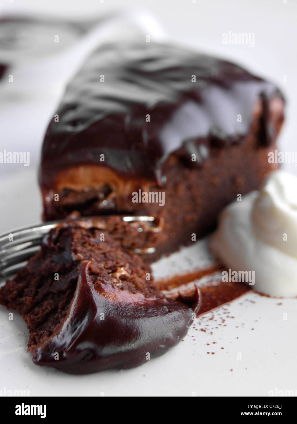 Chocolate fudge cake slice Stock Photo Alamy