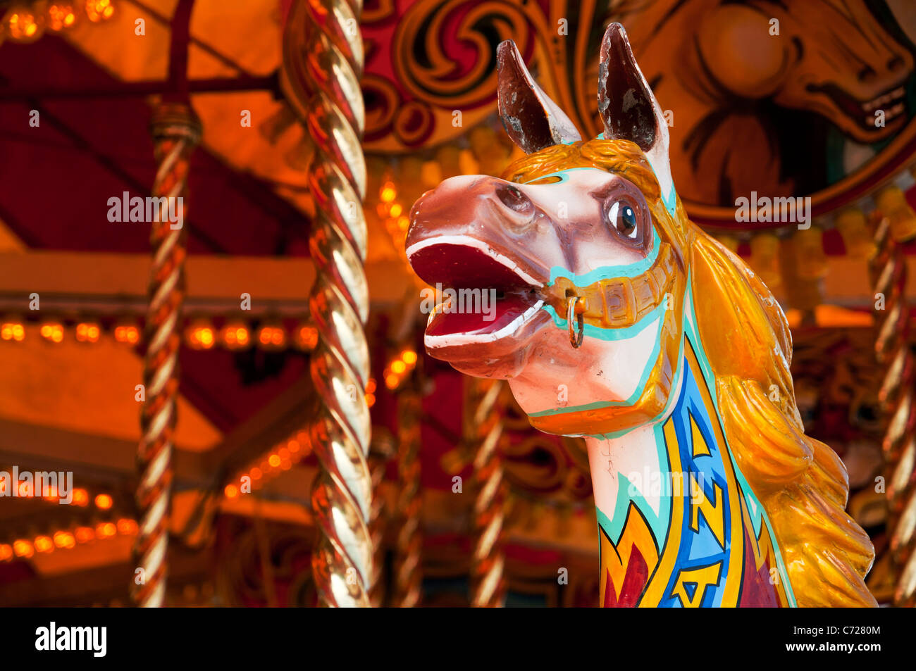 Painted wooden horses on a merry-go-round, Devon UK Stock Photo