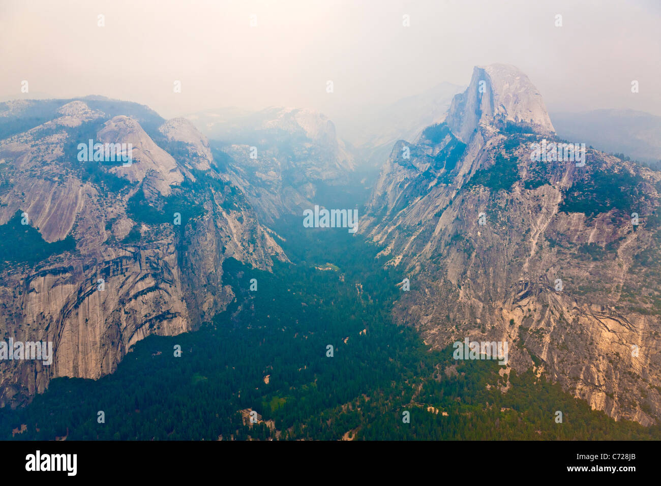 Yosemite Valley from Glacier Point, El Capitan left , Half Dome right with forest fire smoke haze. JMH5257 Stock Photo