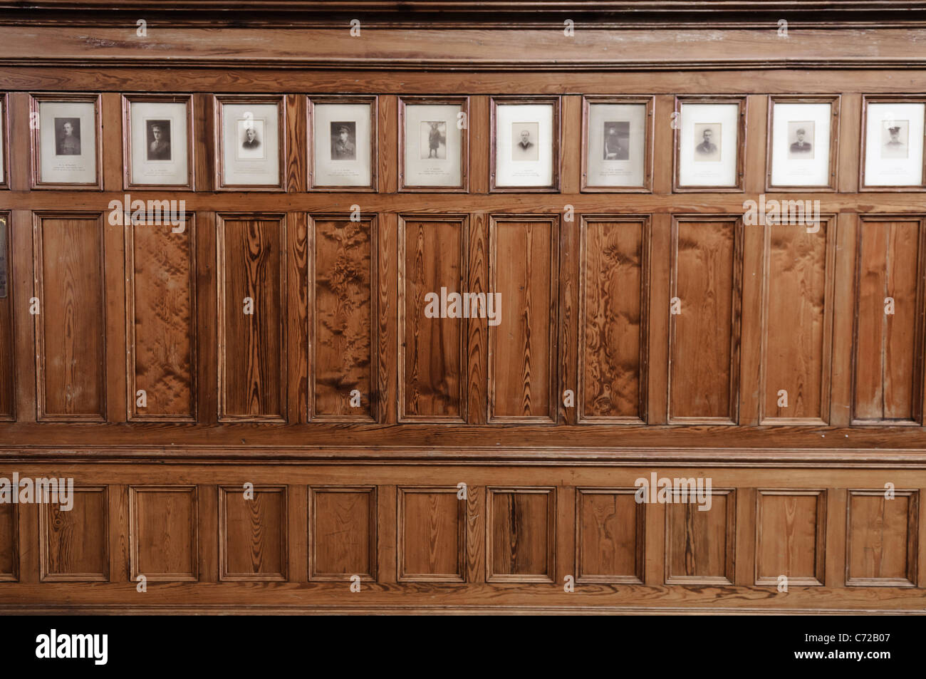 Photographs of soldiers killed during World War 1 inset into wood panelling Stock Photo