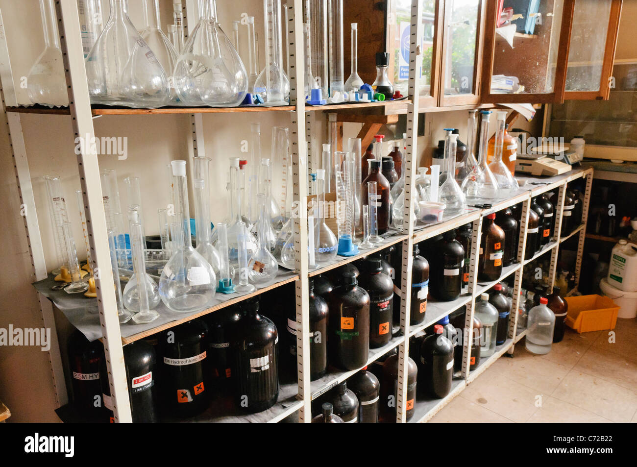 Chemicals on the shelves of a school chemistry laboratory Stock Photo