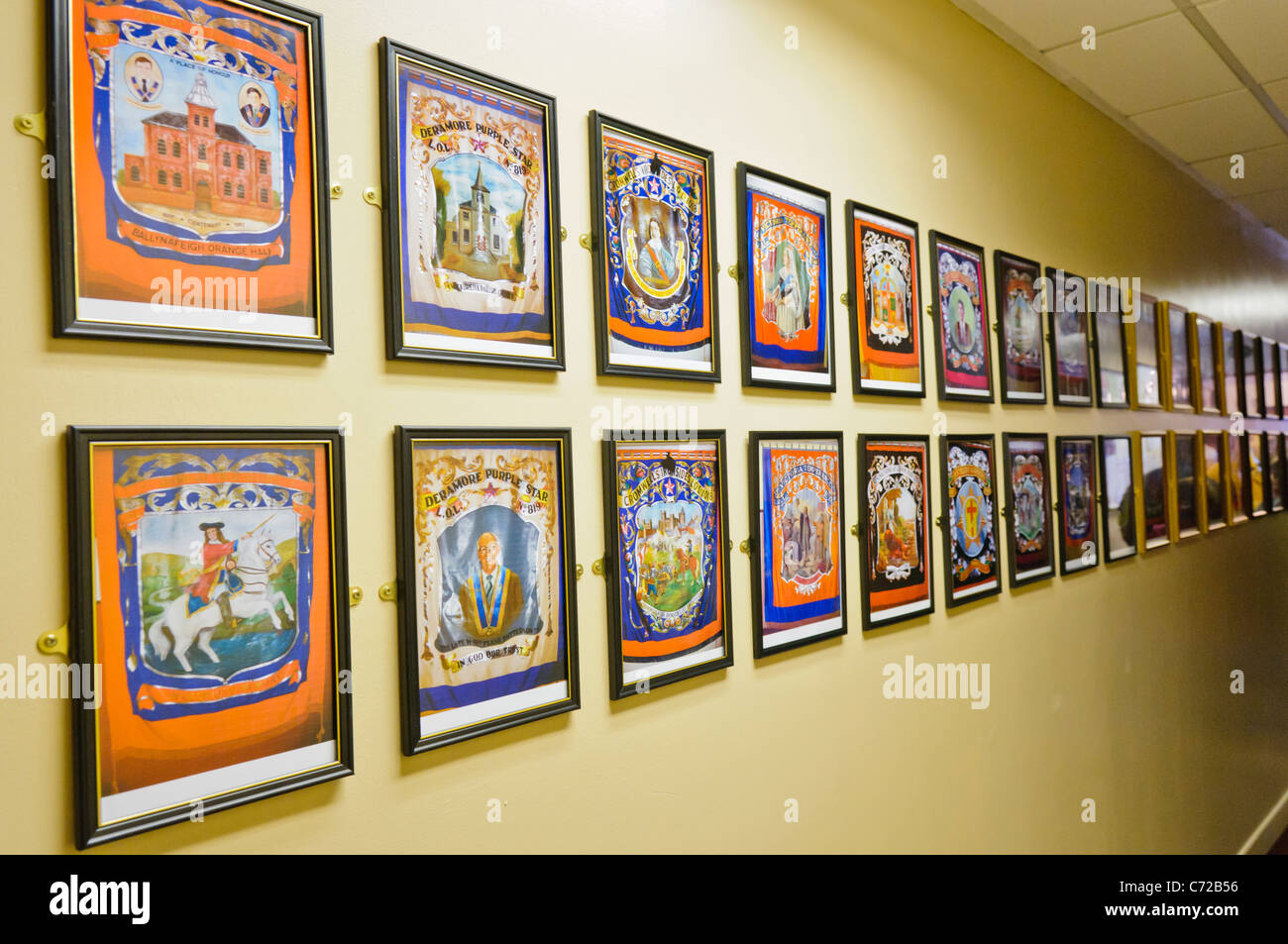 Wall in an Orange Hall with photographs of Orange Banners Stock Photo