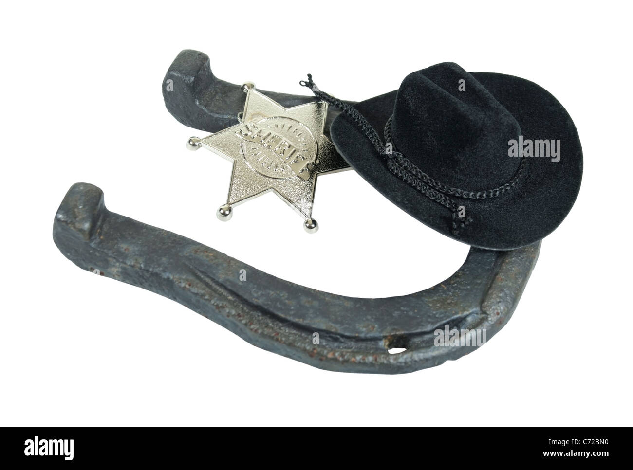 Old worn horseshoe that is usually worn on the hoof of a horse - path included Stock Photo