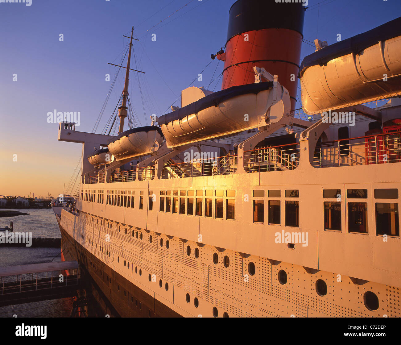 The Queen Mary at sunset, Queens Highway, Long Beach, Los Angeles, California, United States of America Stock Photo