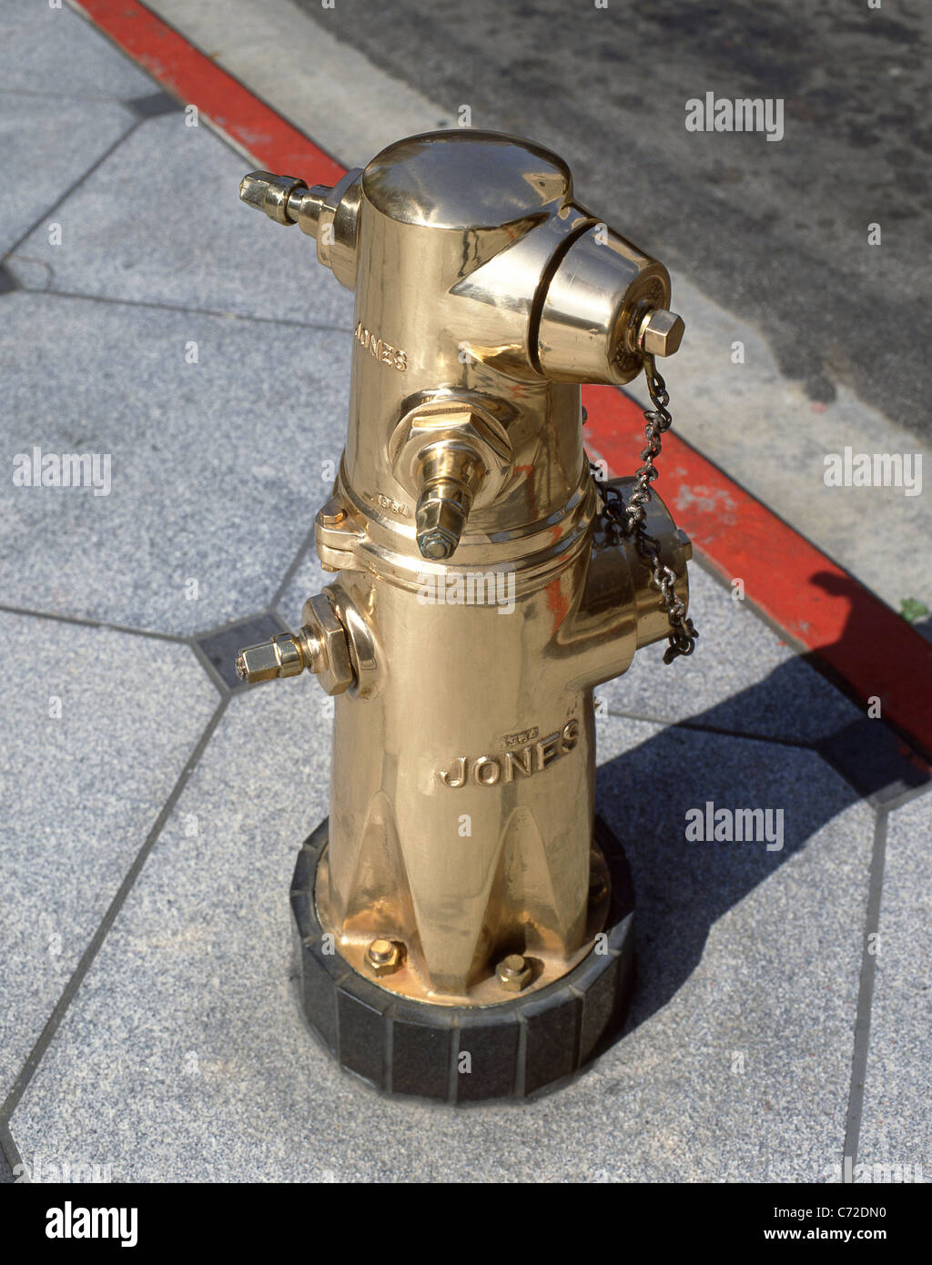 Copper-coloured fire hydrant on sidewalk, San Diego, California, United States of America Stock Photo