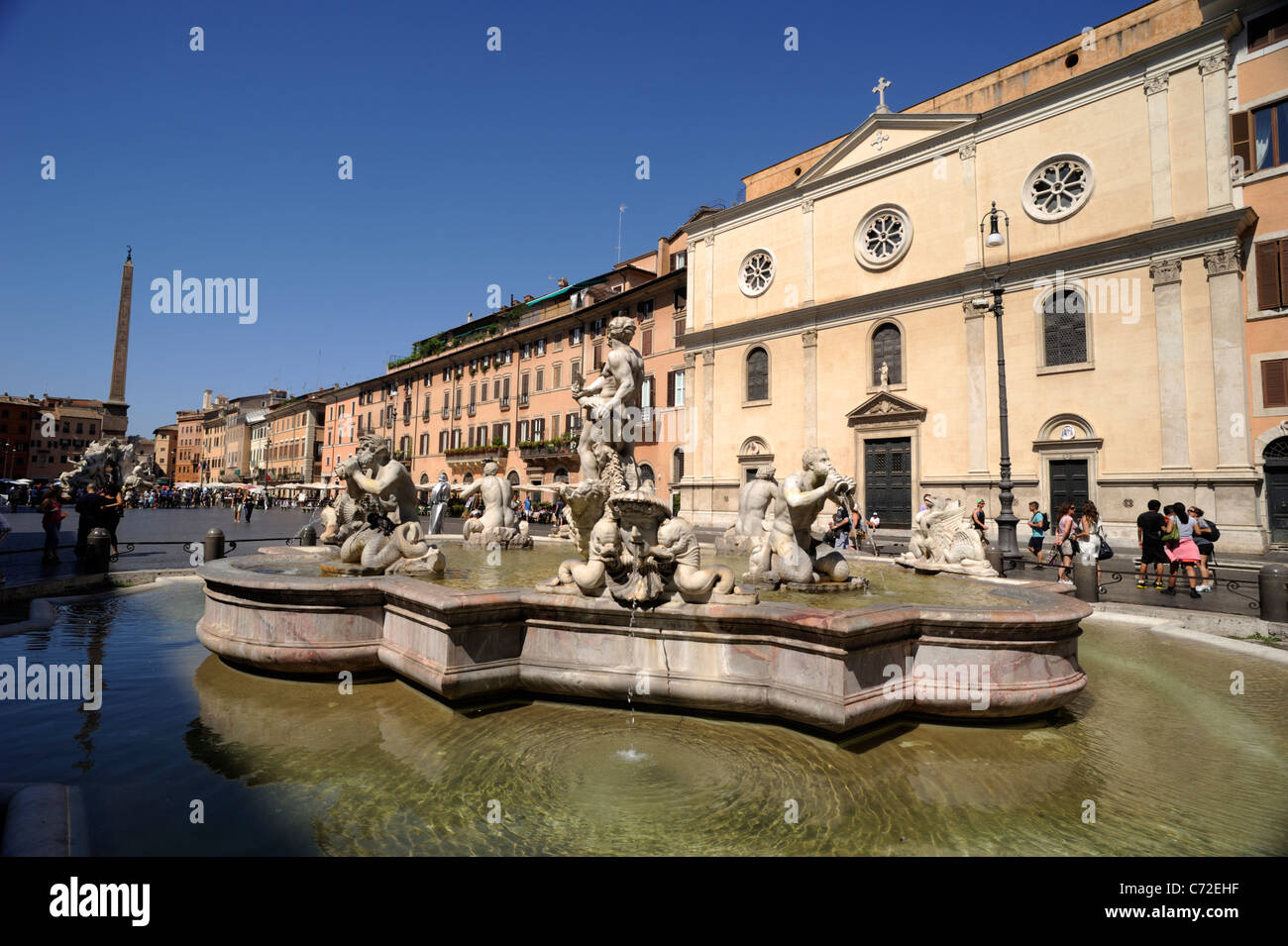 Italy, Rome, Piazza Navona, fountain of the Moor and church of Nostra Signora del Sacro Cuore Stock Photo