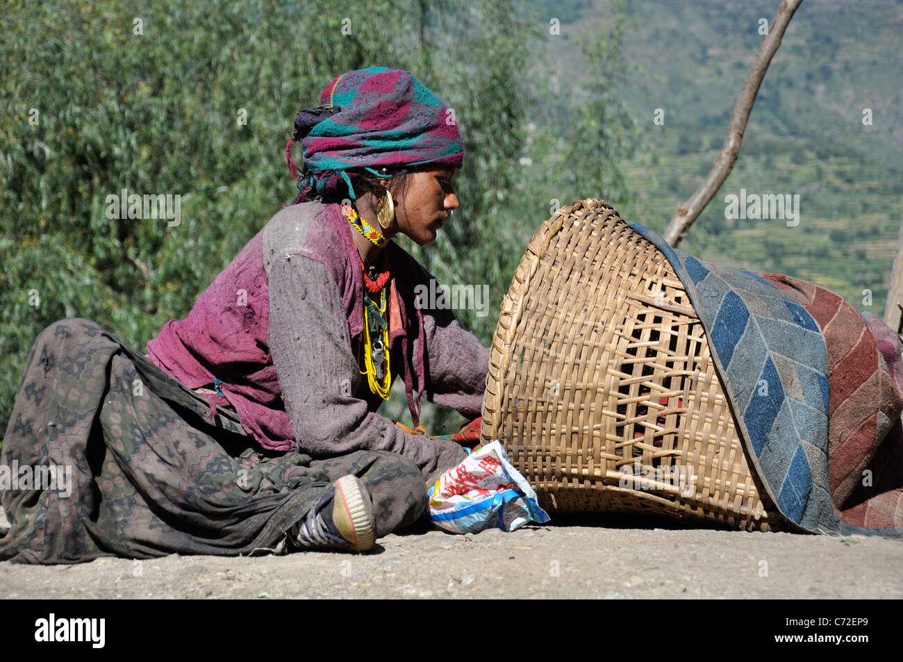 A Humla mother is using Sun Therapy for her baby. Stock Photo