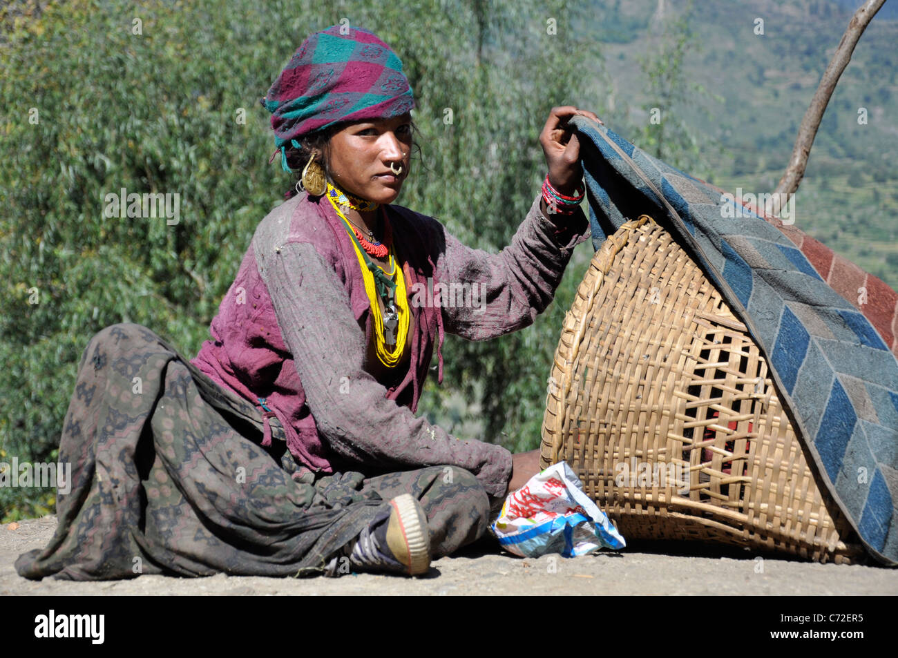A Sunuwar mother using sun therapy for her new burn infant in Humla. Stock Photo