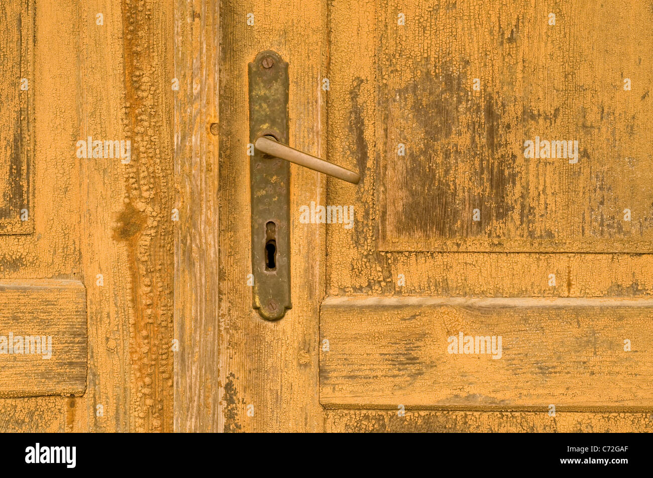 View on an old door handle on a farm house in Poland. Stock Photo