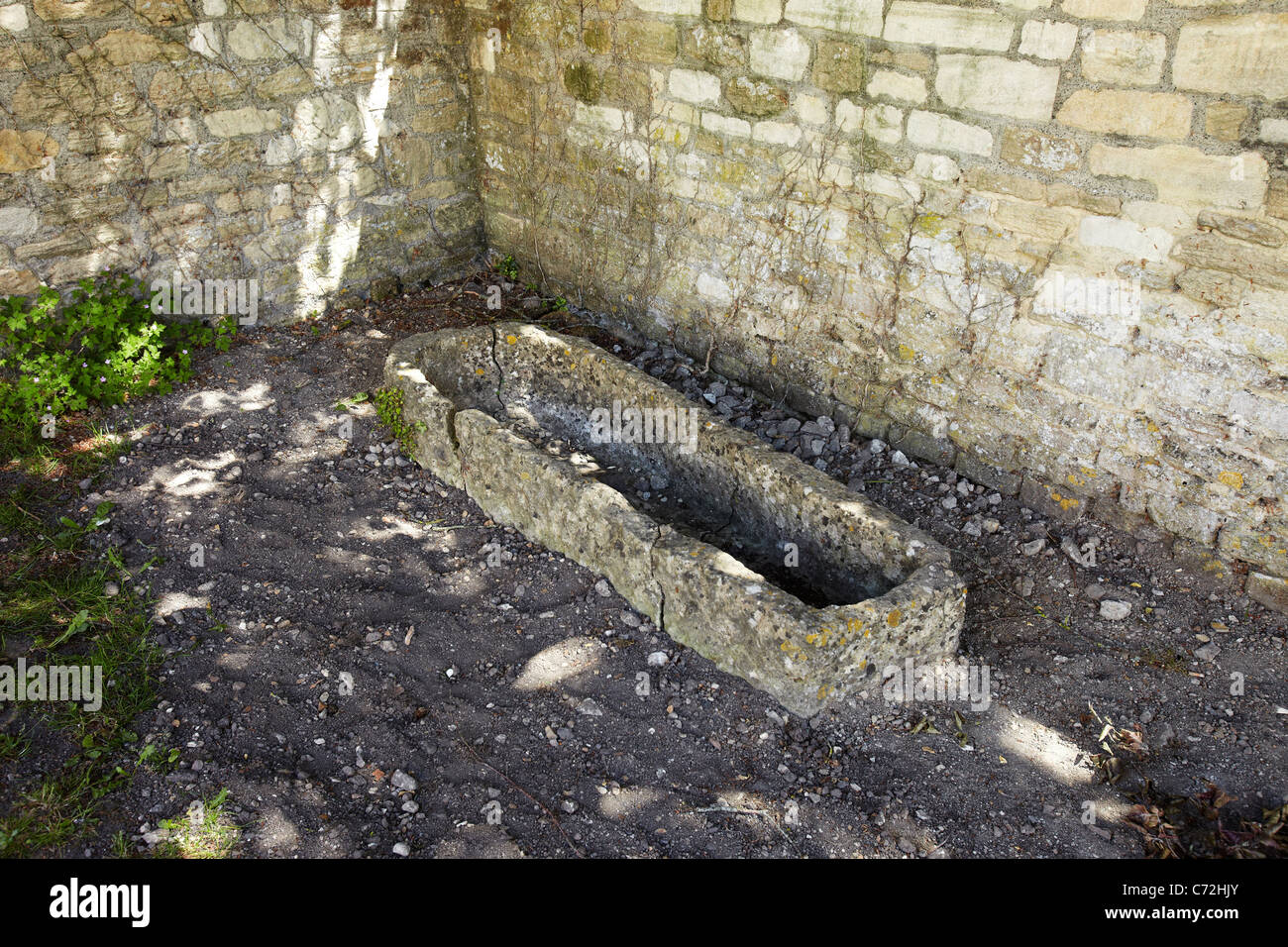 Stone Coffin, in the grounds of St Laurence Saxon Church, Bradford on Avon, Wiltshire, England, UK Stock Photo