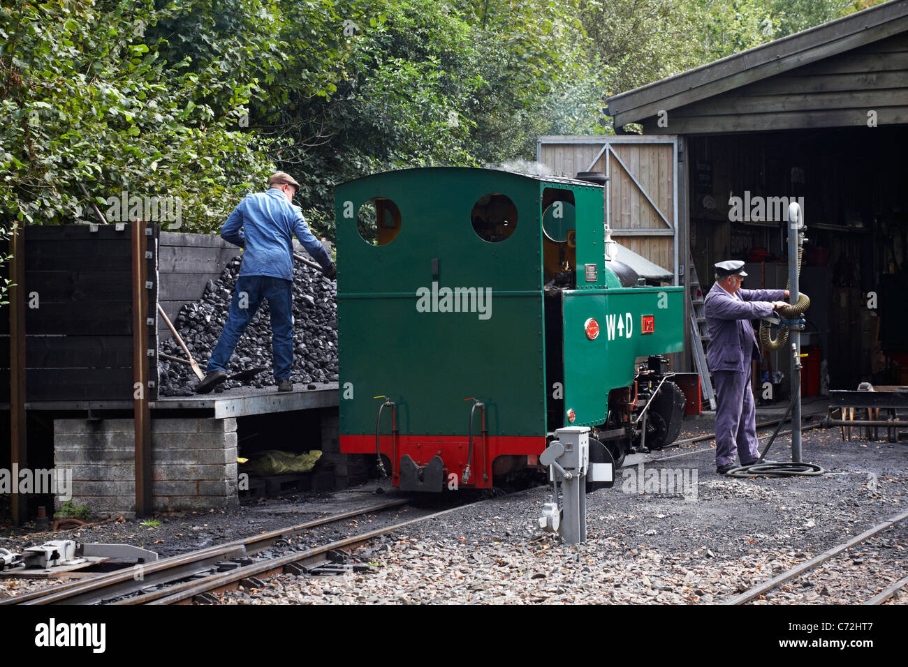 Filling up the engine at Woody Bay Station in August Stock Photo