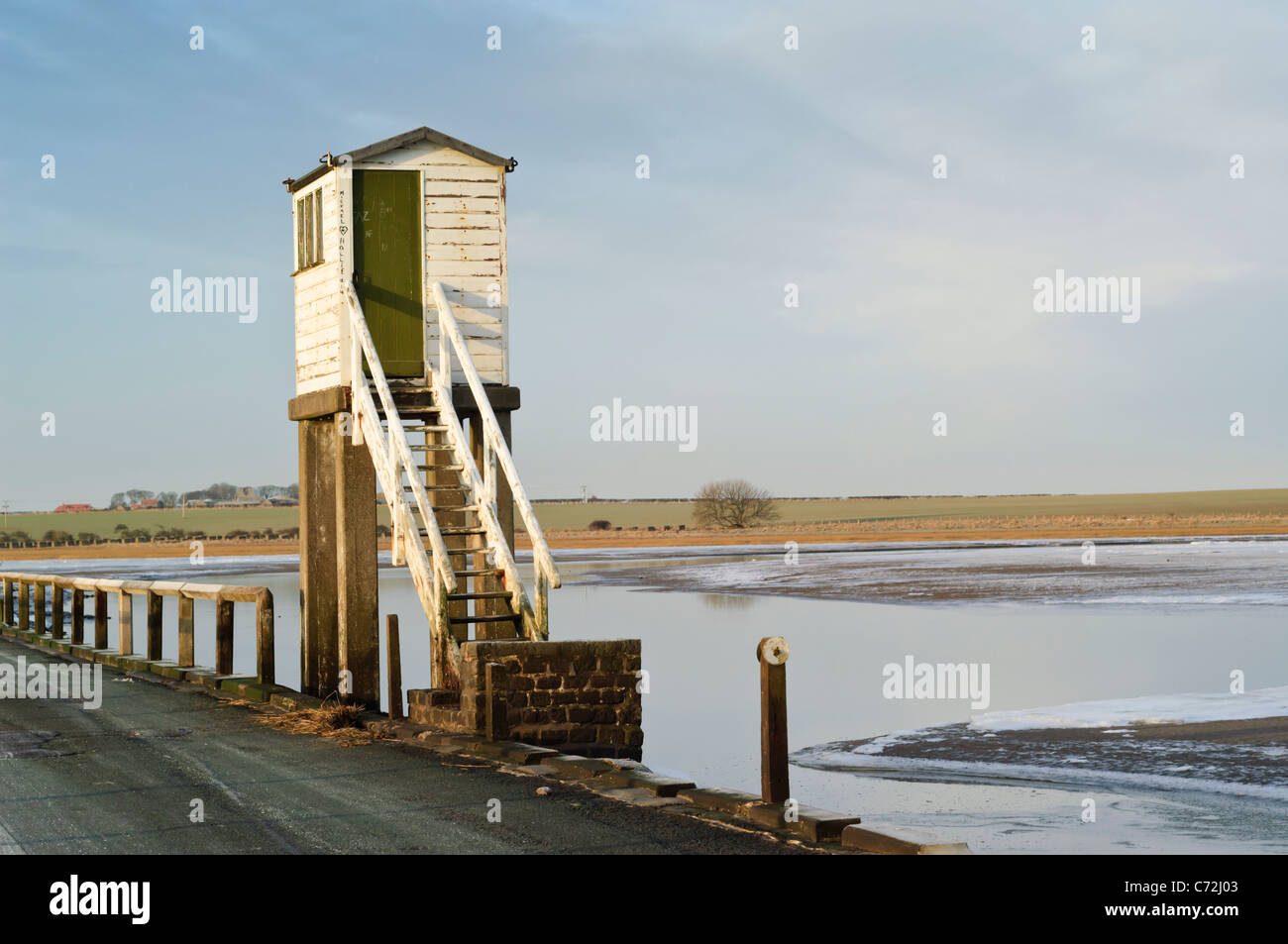 Refuge cabin on the tidal causeway road leading to Lindisfarne. Stock Photo