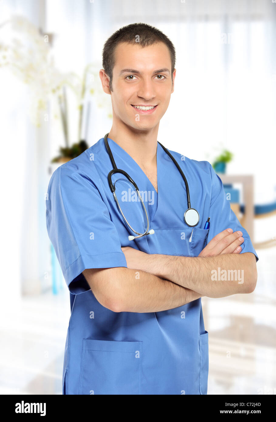 A portrait of a medical doctor with stethoscope posing in his office