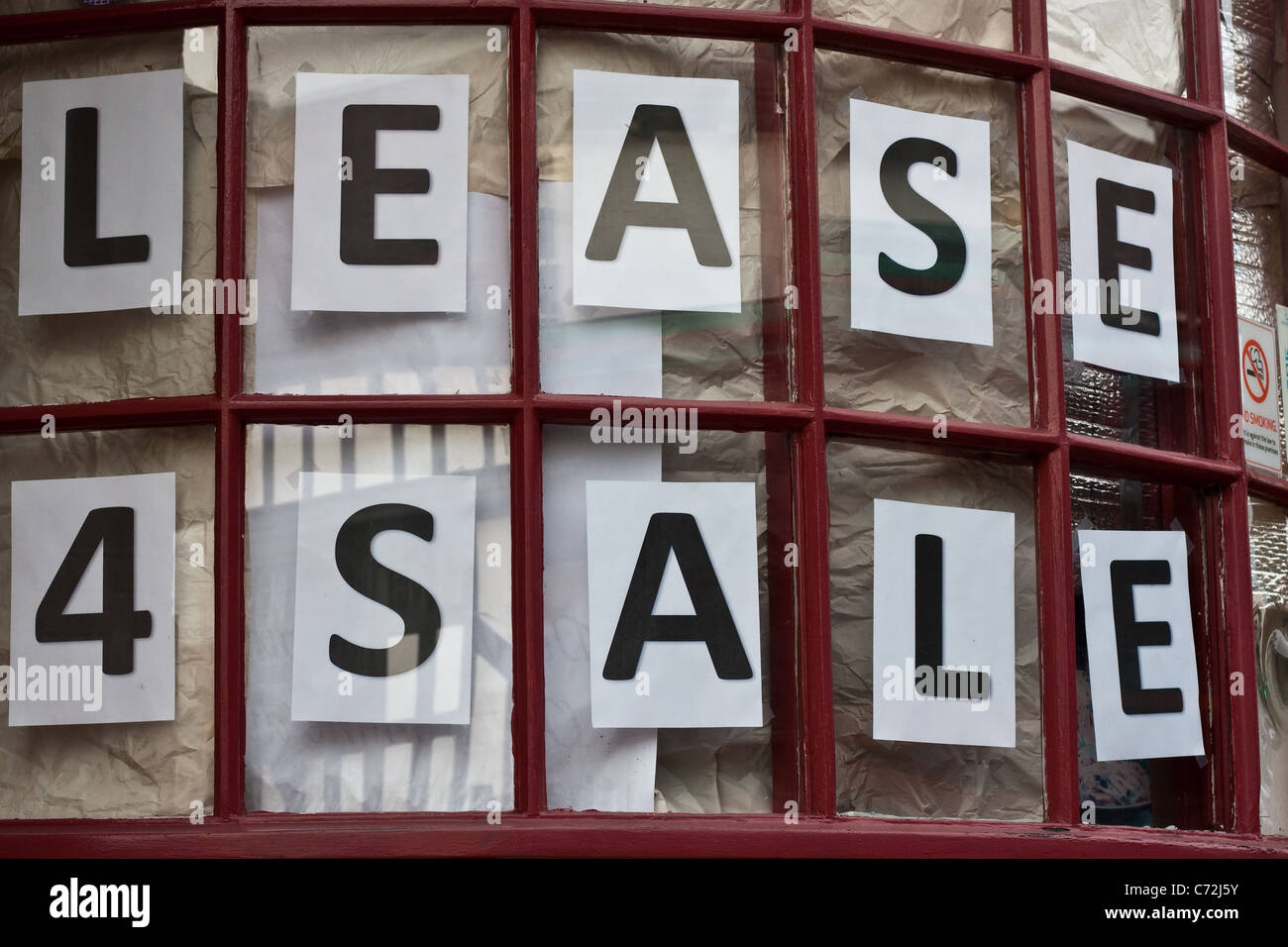 Lease for sale sign in a shop window in UK Stock Photo