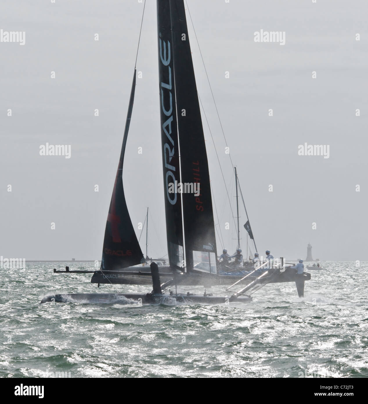 Americas Cup 2011 - the USA boat Oracle skimming across the silver ...