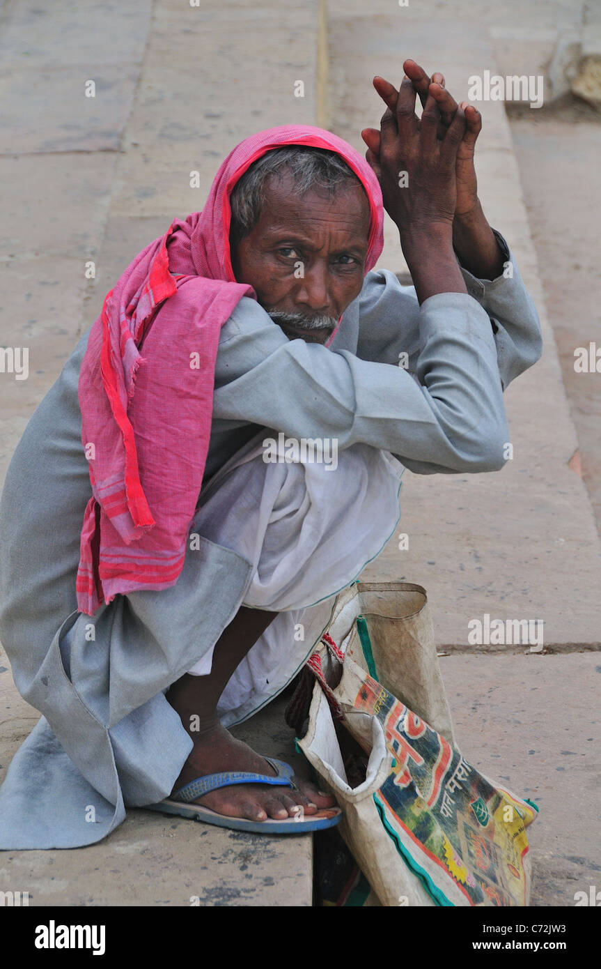 Pilgrim man at the ghat by the Ganges river Stock Photo - Alamy