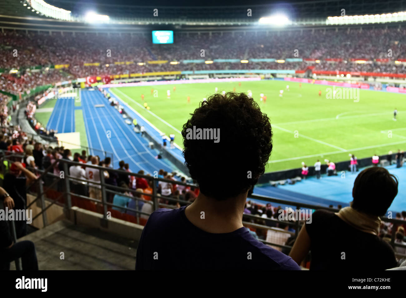 A football fan watching a game live in Vienna's main stadium Stock