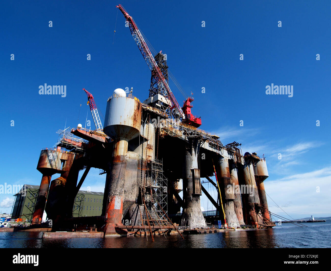 An oil rig moored at Invergordon Harbour, undergoing repair and