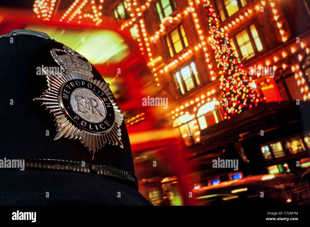 LONDON POLICE CRIME CHRISTMAS BREATHALIZER ROAD Metropolitan Police helmet with Christmas tree and lights Harrods Knightsbridge London UK Stock Photo