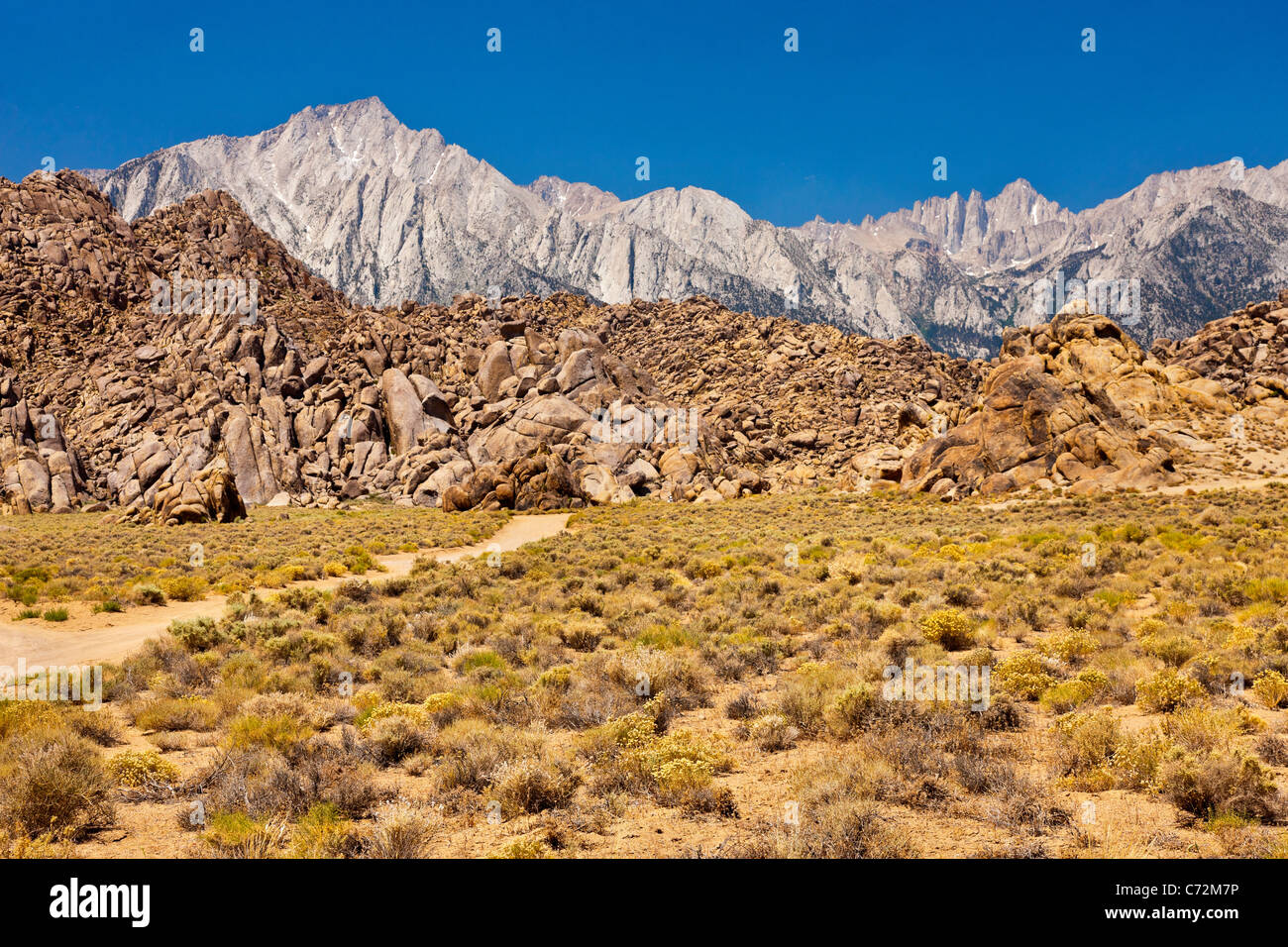 The Alabama Hills, backed by Lone Pine Peak (left) and Mount Whitney (right) in the Sierra Nevada, California, USA. JMH5328 Stock Photo