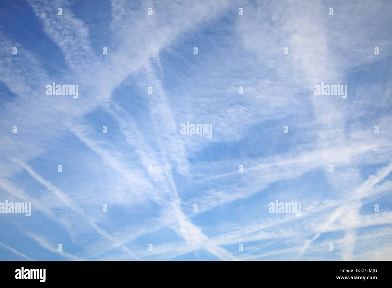 Clearly visible trails of aircraft exhaust fumes in the sky Stock Photo