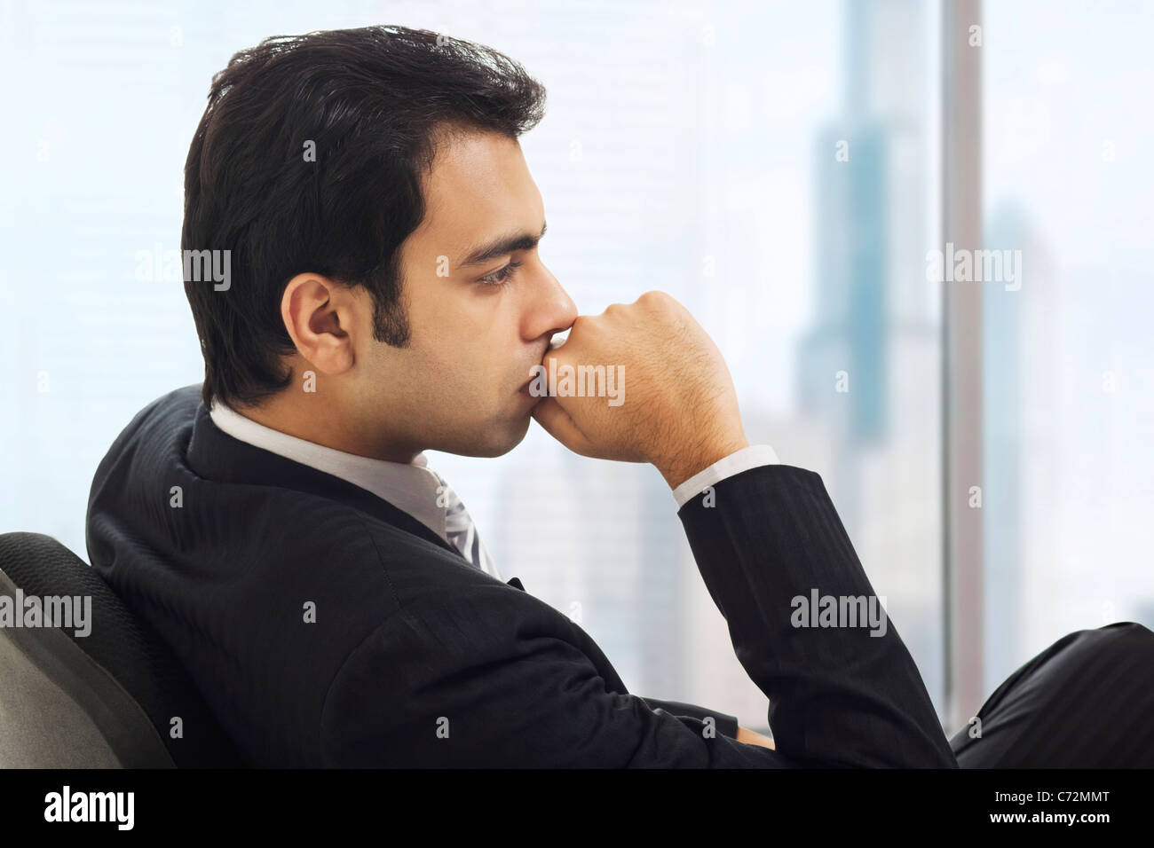 Businessman in deep thought Stock Photo