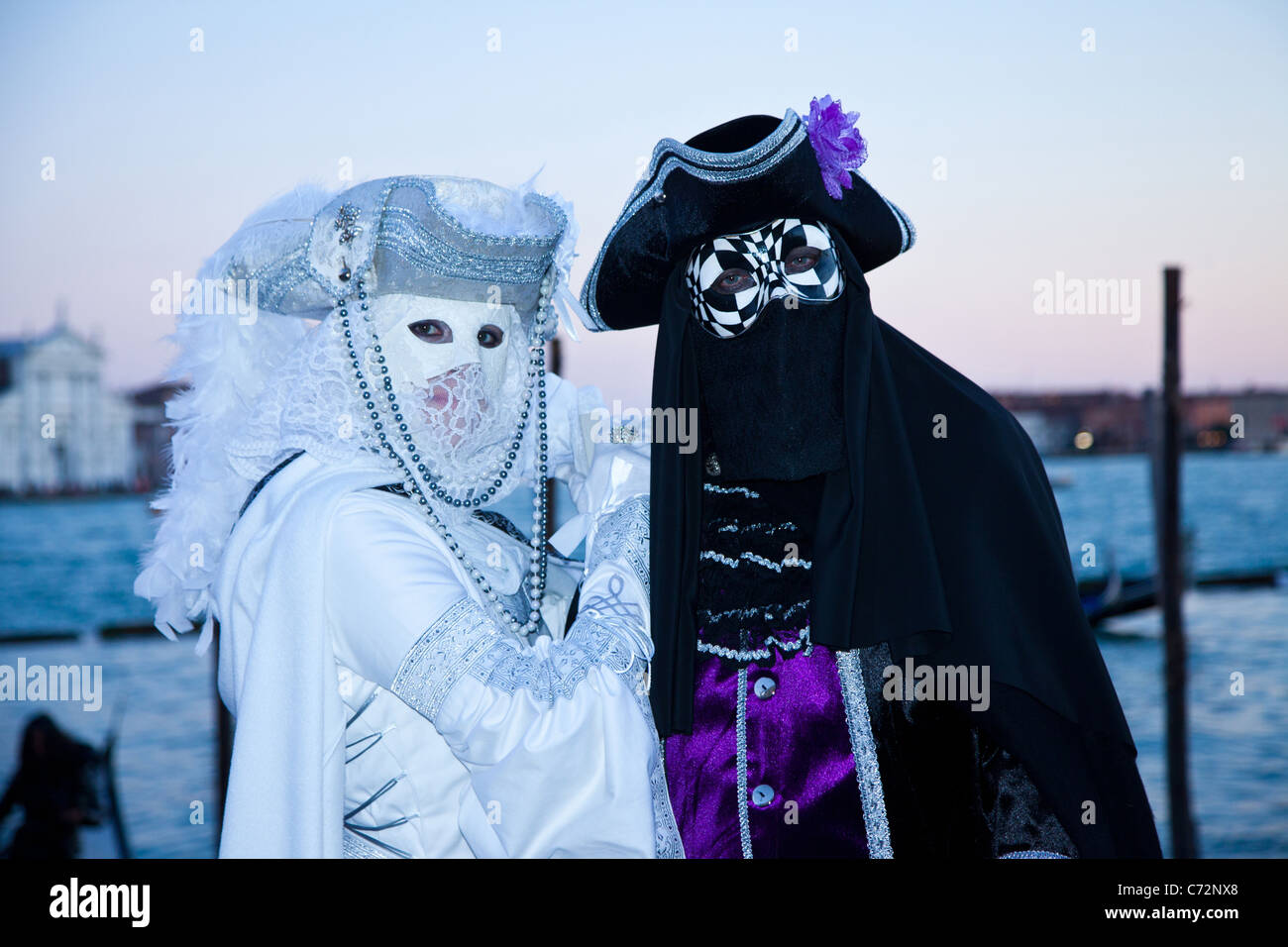 Costumed participants of Carnivale in Venice Italy. Stock Photo