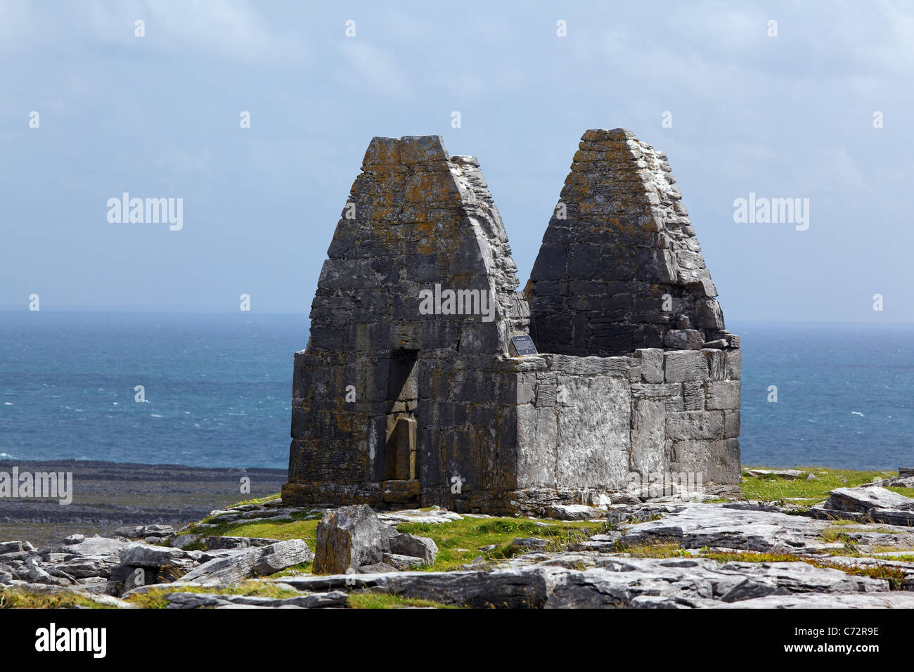 Remains of St. Benen's Church (Teampull Bheanáin) overlook Atlantic Ocean, Inishmore, Aran Islands, County Galway, Ireland Stock Photo