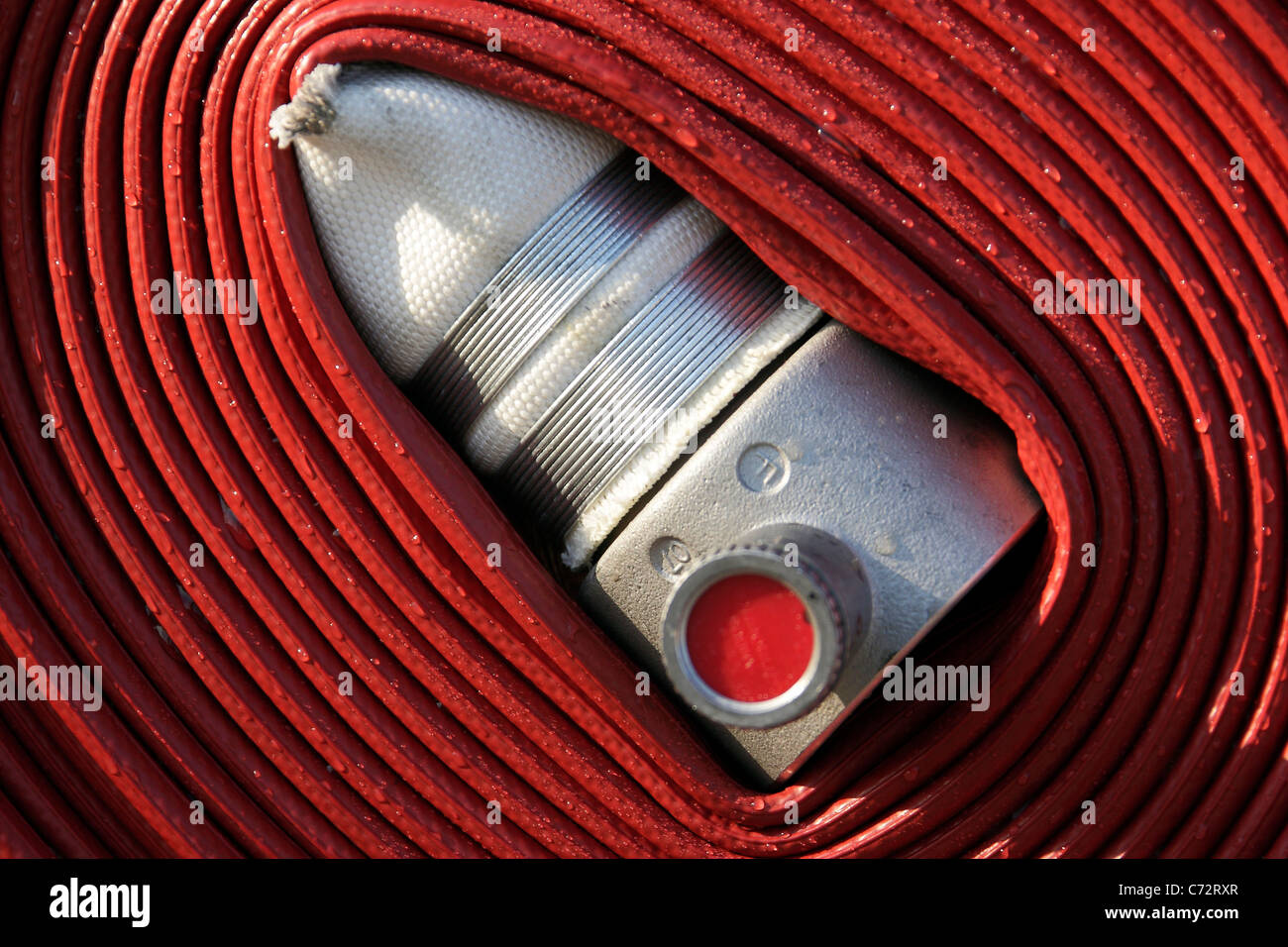 Rolled up fire hose hires stock photography and images Alamy