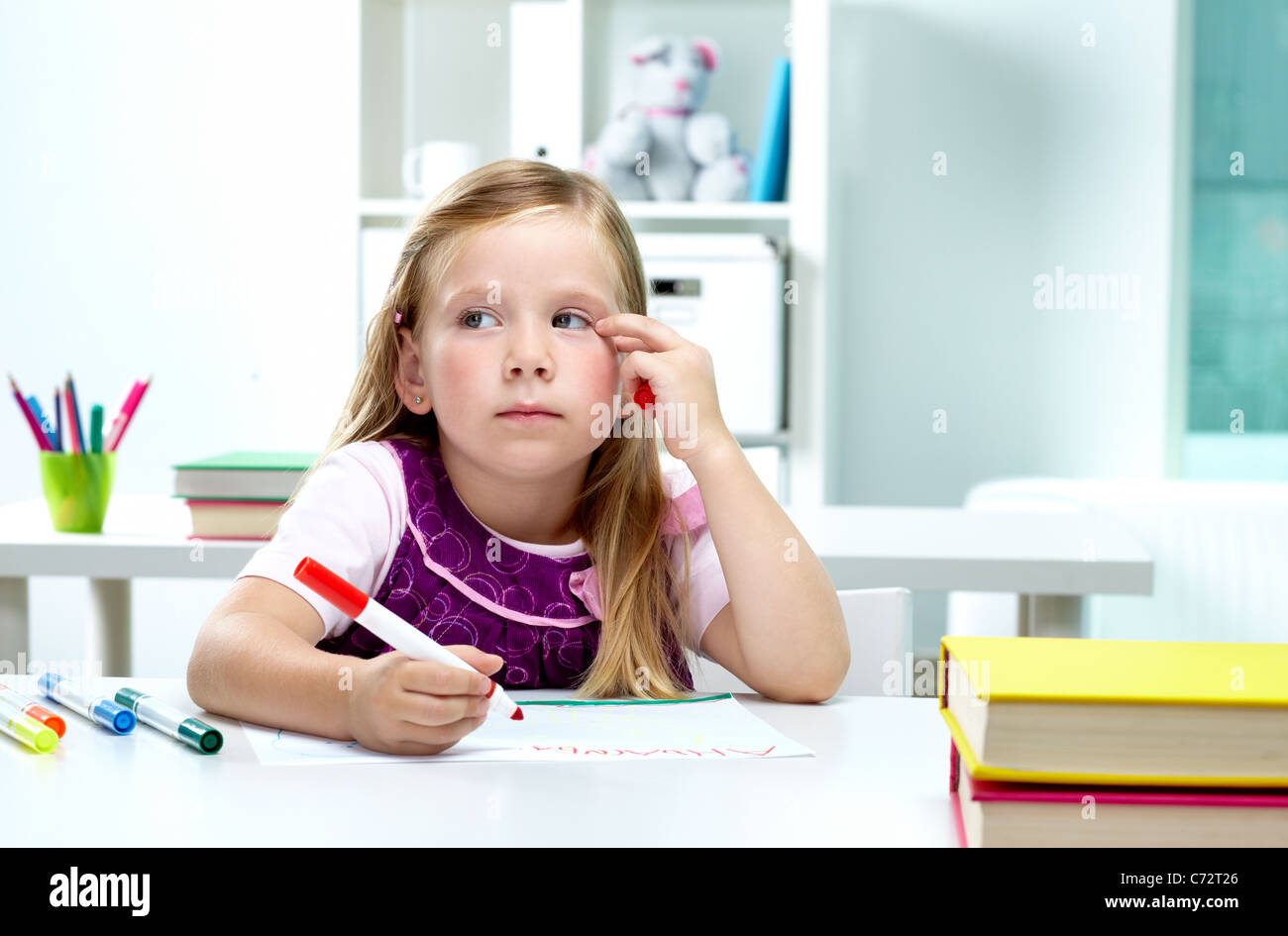 Portrait of lovely girl drawing with colorful pencils Stock Photo - Alamy