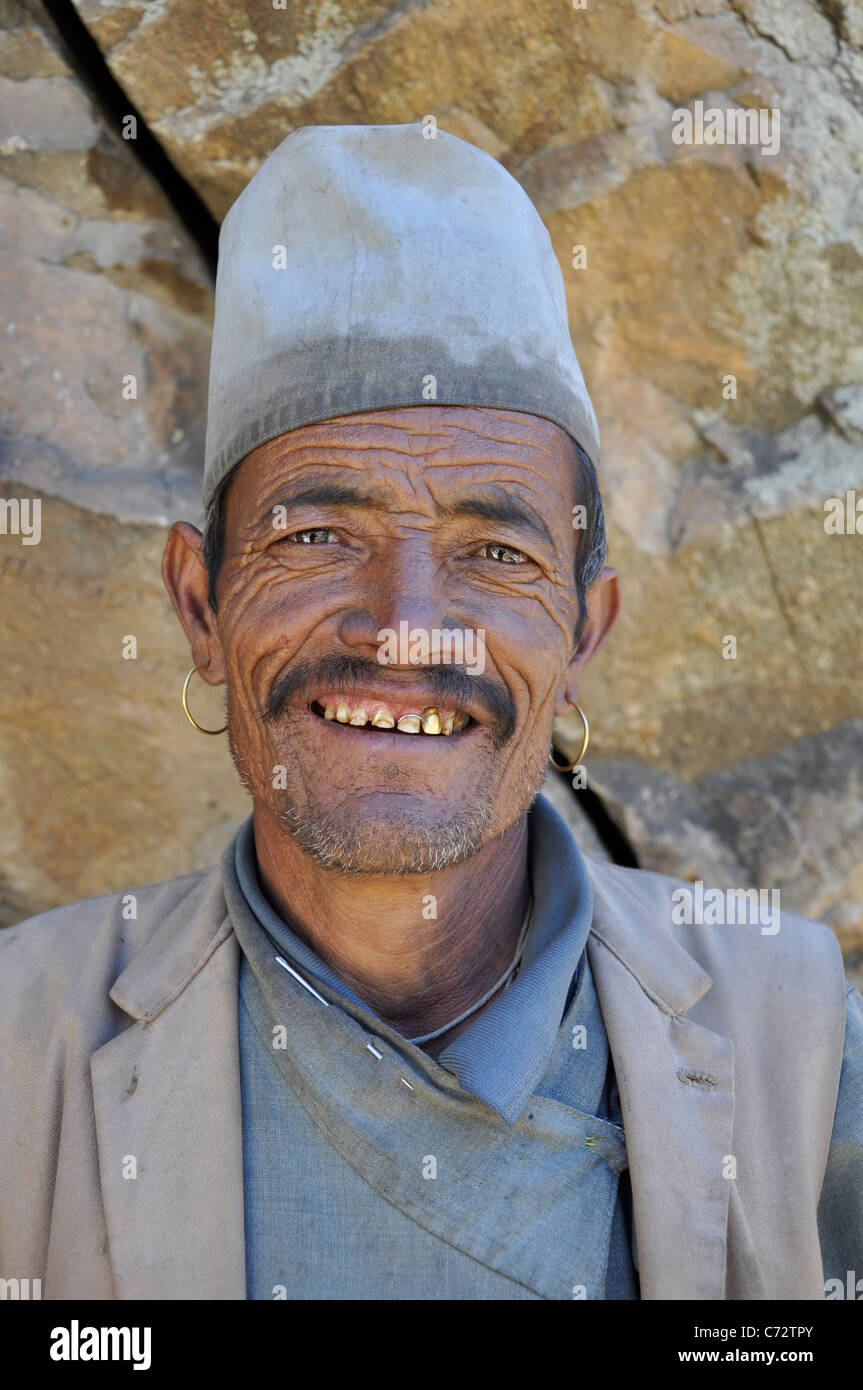 A Thakuri man is waiting for the community oil mill runner in Yanger, Humla. Stock Photo