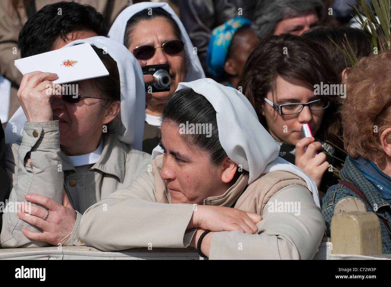 South American nuns waiting in the crowd for the Pope's procession, Saint Peter's Square, Palm Sunday 2011 Vatican City Stock Photo