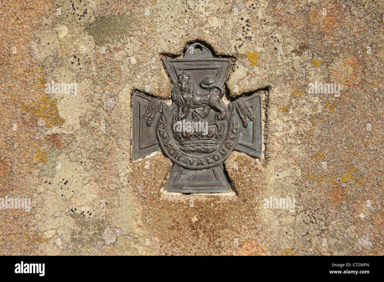 A replica Victoria Cross Medal embedded in the headstone of a VC