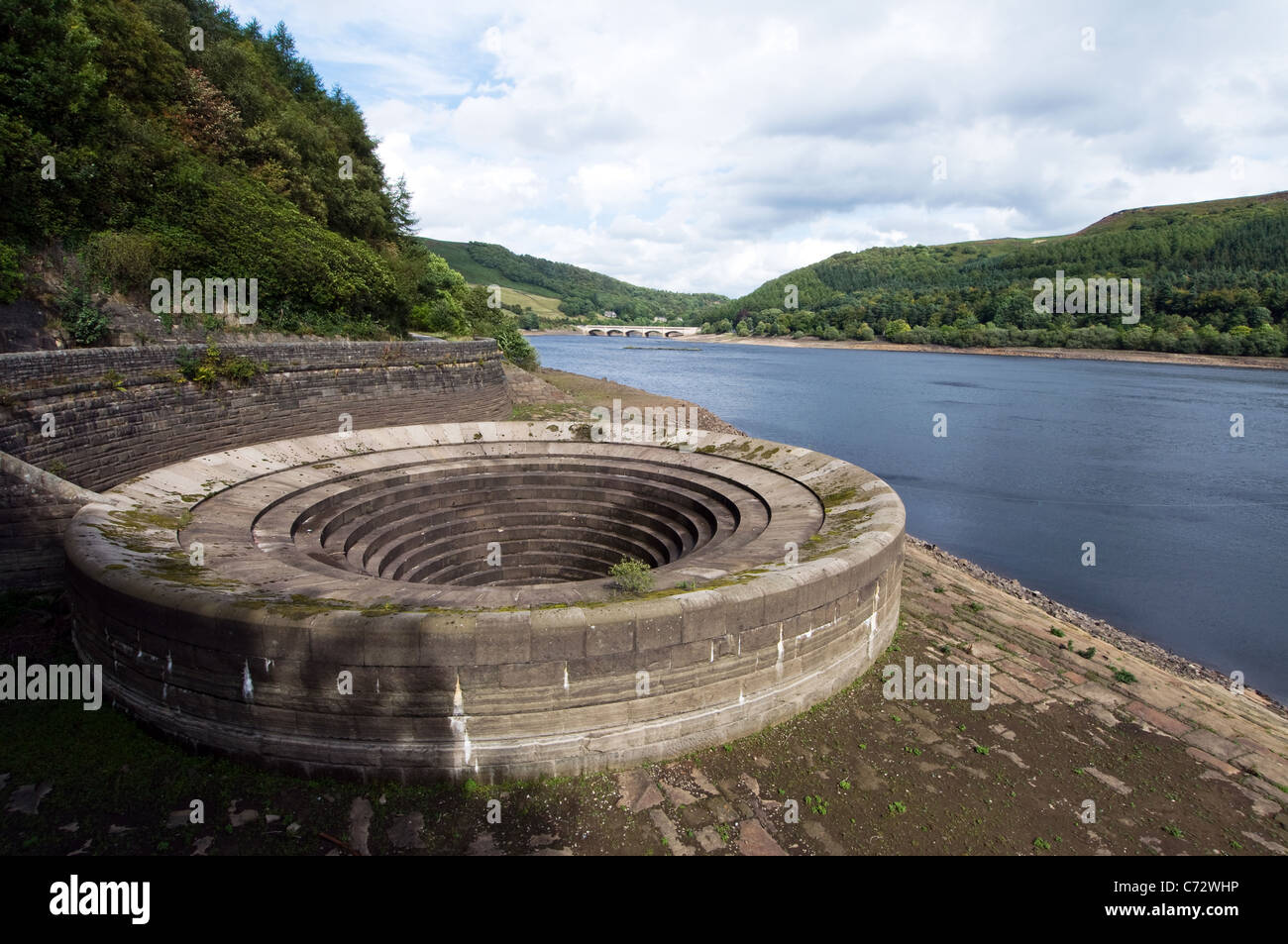 One of the bellmouth overflows also known as the plugholes at Ladybower Reservoir in the Derwent Valley Derbyshire Stock Photo