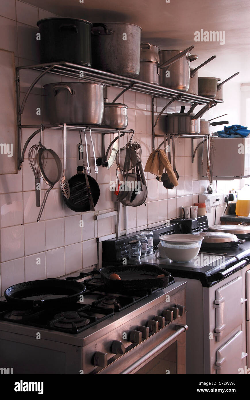 A kitchen with cooking appliances and utensils UK Stock Photo