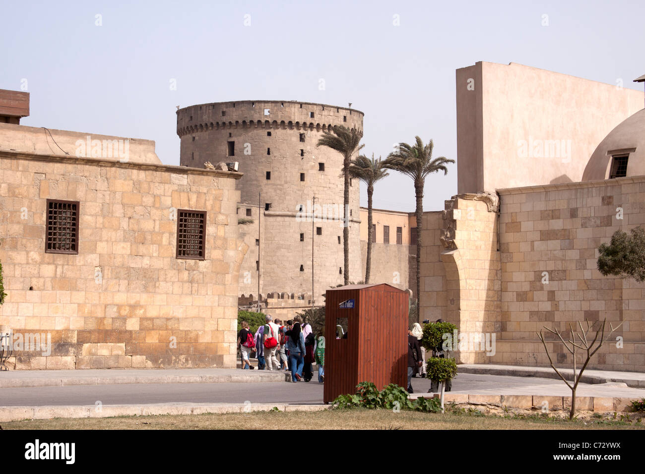 People entering through the gates of the Saladin Citadel. The Saladin Citadel is built on the Mokattam hill in Center. Stock Photo