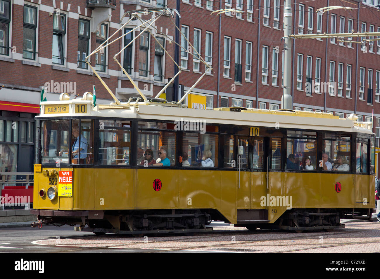 An old traditional streetcar still in operation as a sightseeing tram here on the streets of Delfshaven, Rotterdam Stock Photo