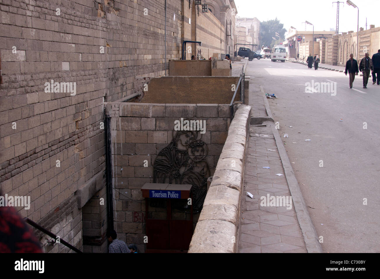 Scene outside Coptic area in Egypt, entering the area from the main road through a down staircase connecting to monuments. Stock Photo