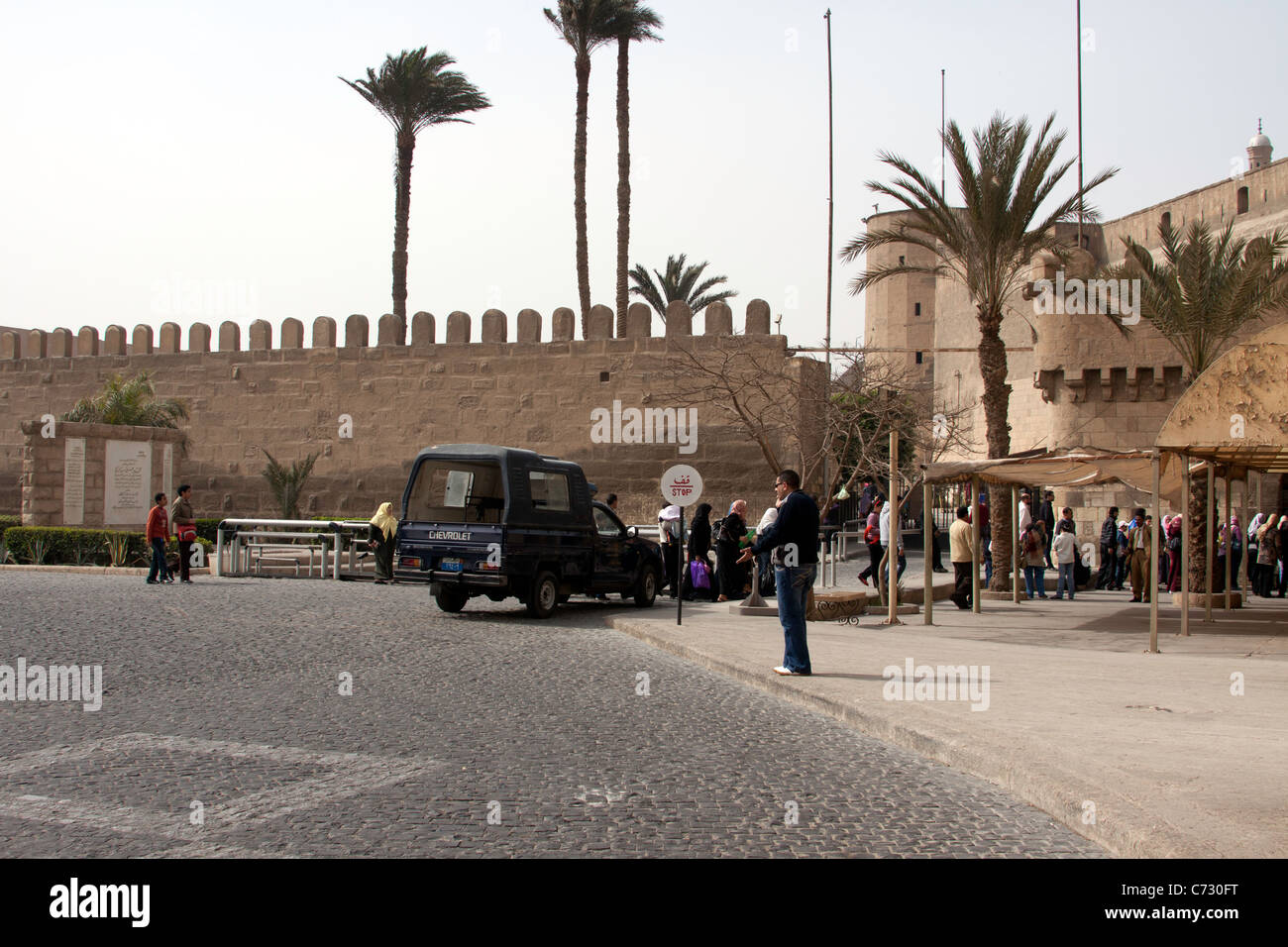 Tourists outside Saladin Citadel near the entry. This is in Cairo built by the emperor Saladin, a medieval fortification. Stock Photo